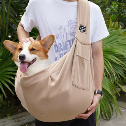 corgi transporté dans sac transport chien beige bandoulière